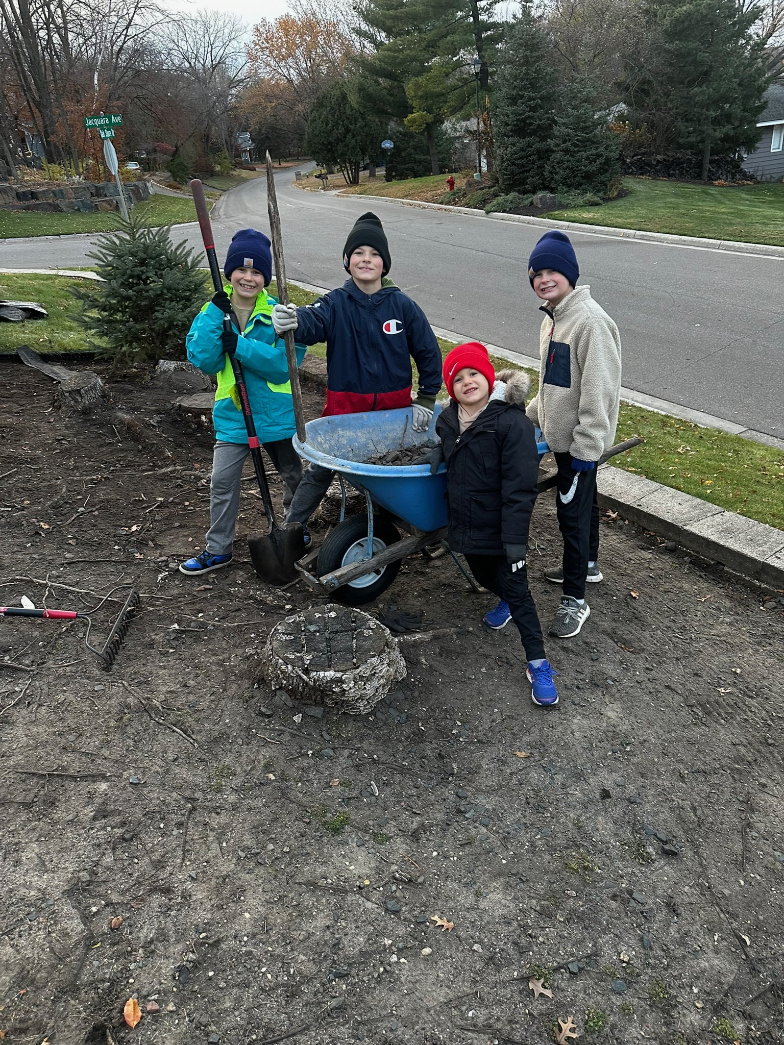 Group shot with tools and mower
